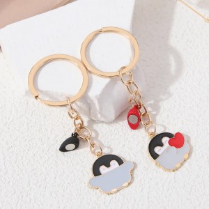 Pareja llaveros pingüinos